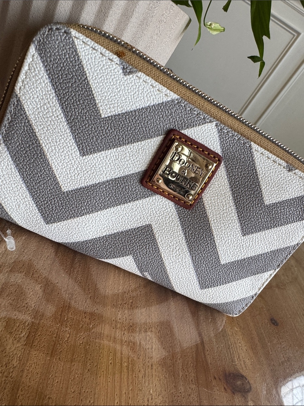 Dooney & Bourke White and Gray Chevron Zip Wallet with Gold Plaque